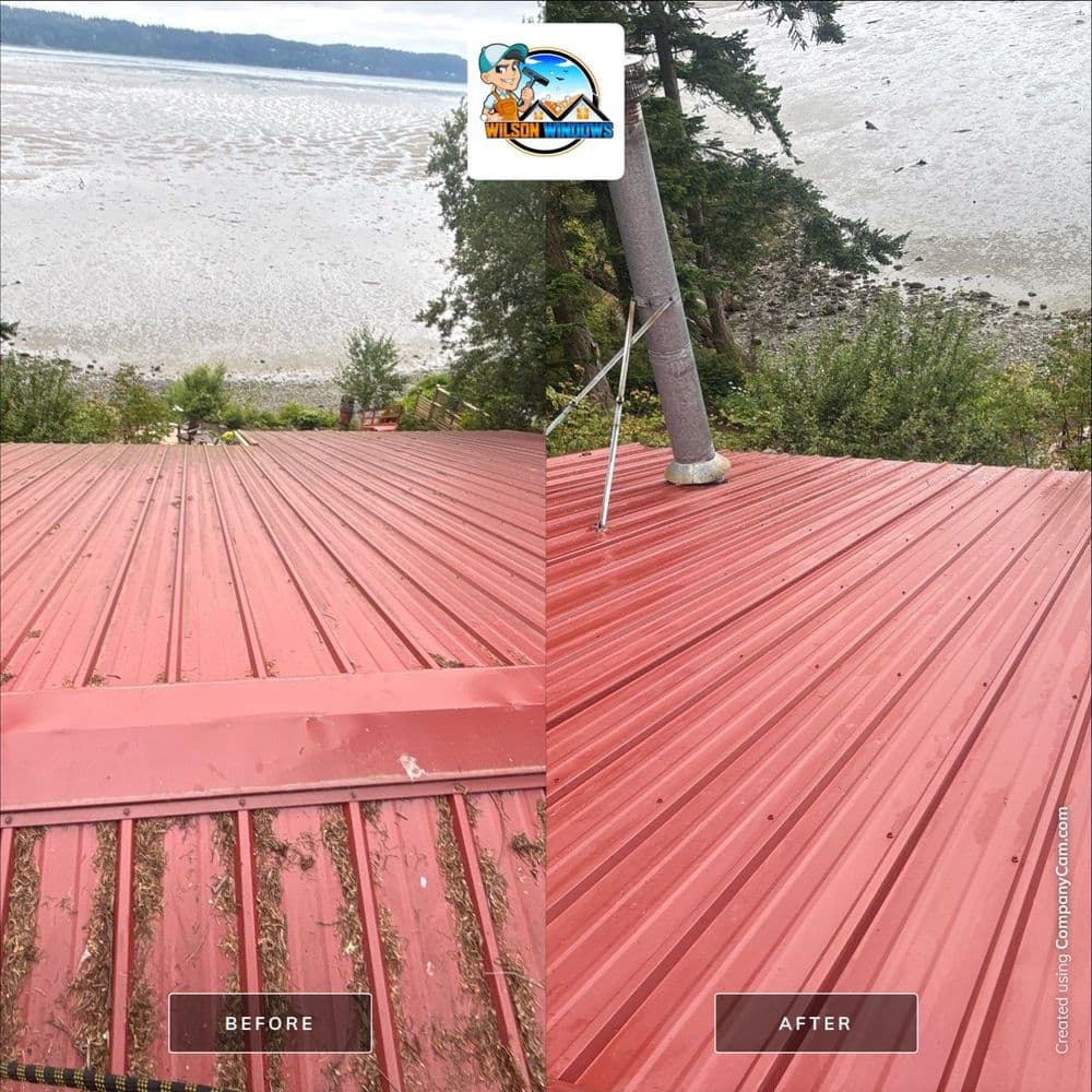 Before and after roof cleaning showing restored red metal roof overlooking a scenic waterfront.